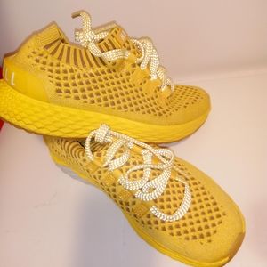 Athletic tennis shoes size 9 women and 7.5 men yellow color